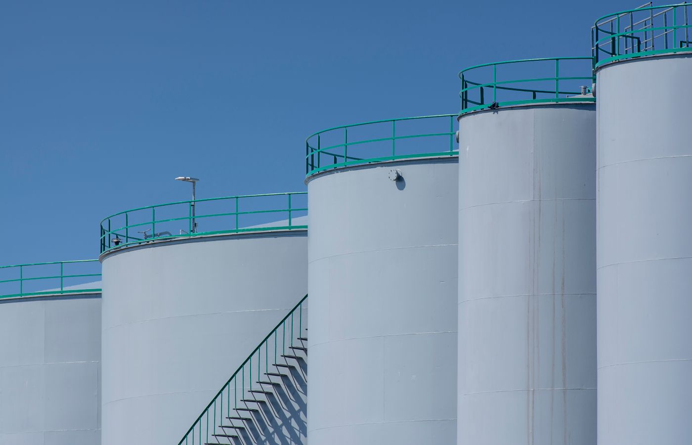 Industrial storage tanks at a rail-served facility