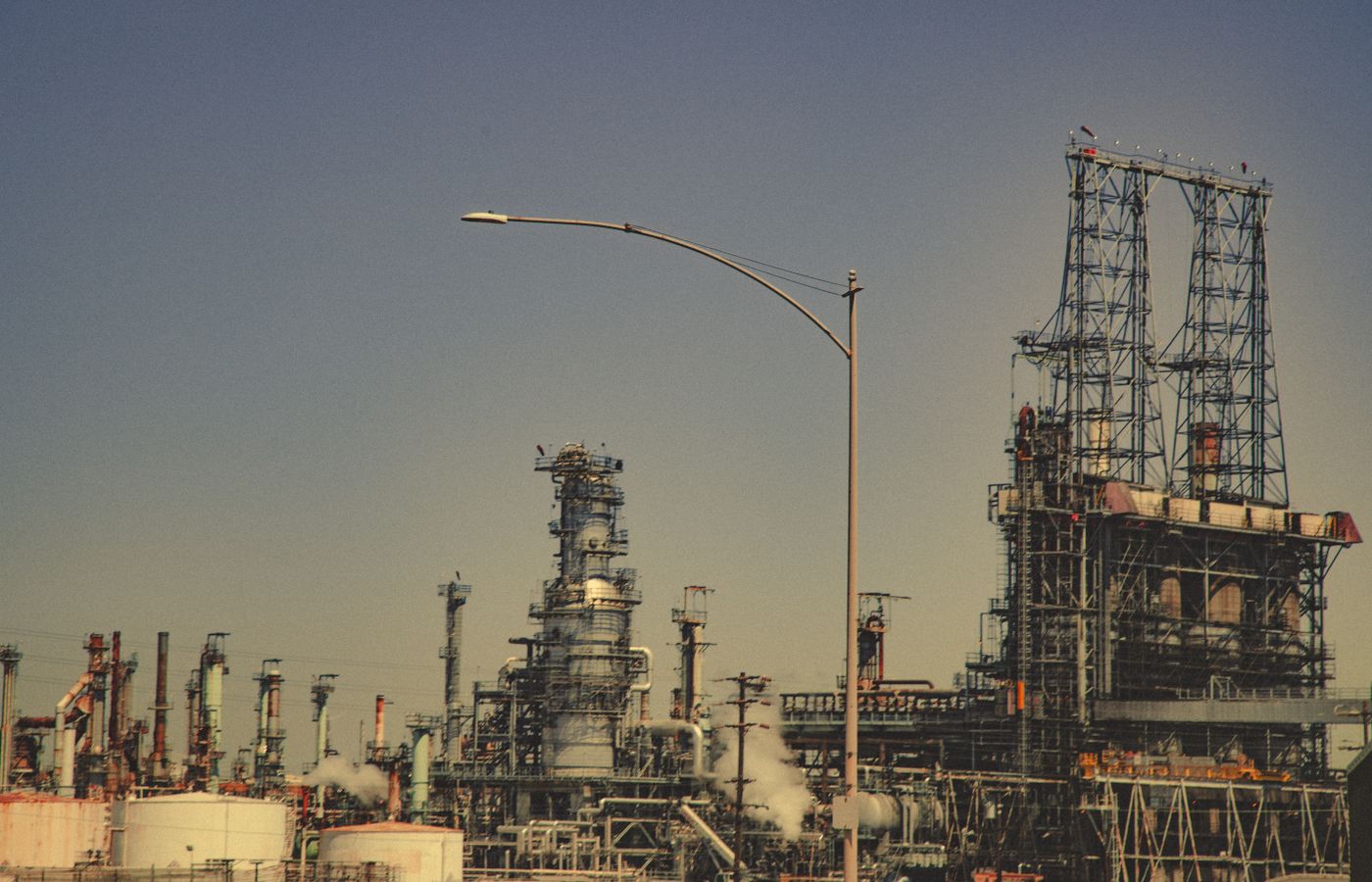 Oil refinery towers and process piping at a petrochemical facility