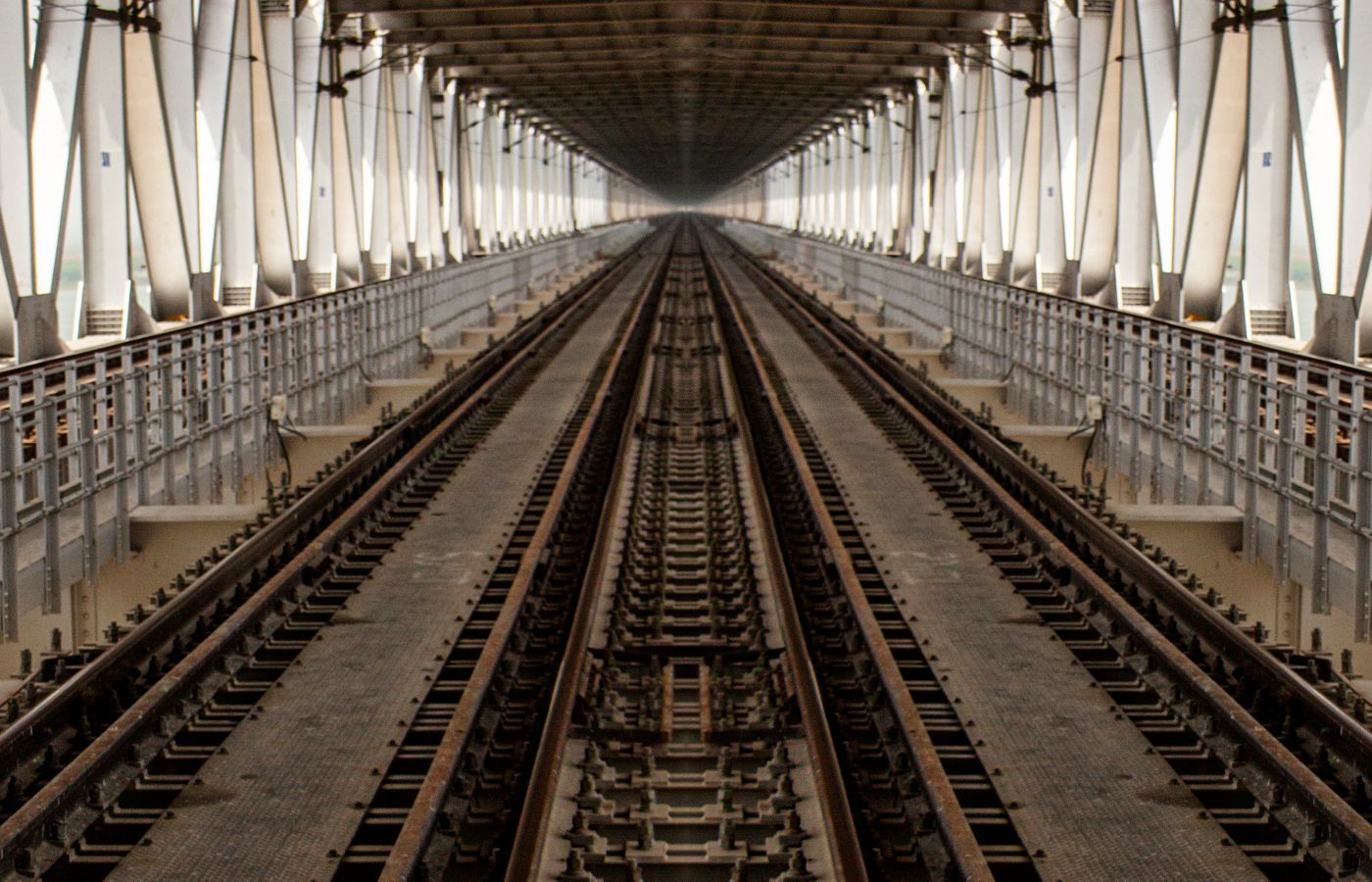 Steel truss railroad bridge carrying track